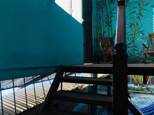 a staircase in a room with a table and chairs at Hotel My Isla Bonita in Moyogalpa