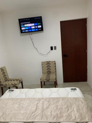 A television and/or entertainment centre at Casa Palmeras