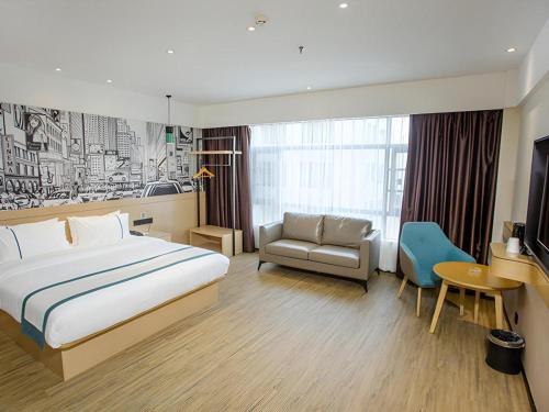 Ένα ή περισσότερα κρεβάτια σε δωμάτιο στο City Comfort Inn Yangxin High-speed Railway Station