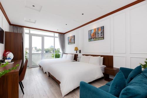 Postel nebo postele na pokoji v ubytování Ancient Luxury Hotel