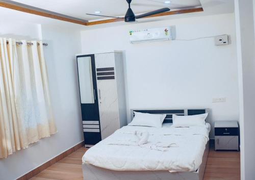 Giường trong phòng chung tại Febune Villas