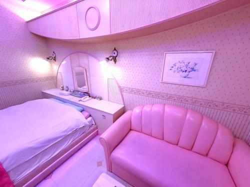 Ένα ή περισσότερα κρεβάτια σε δωμάτιο στο ホテル ニューパレス