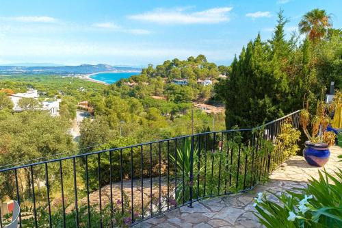 a balcony with a view of the ocean at CASA CHAGUIMAMA Begur in Begur
