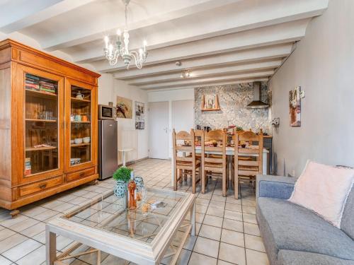 a living room with a couch and a table at Holiday Homes in Ubachsberg with a Picturesque Garden in Ubachsberg