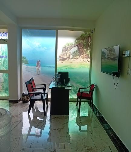 TV a/nebo společenská místnost v ubytování Yuvati Homestay