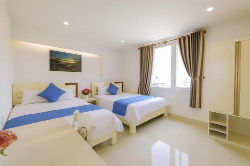 Ένα ή περισσότερα κρεβάτια σε δωμάτιο στο Thanh Downtown Hotel - Bước Chân Là Đến Chợ Đêm