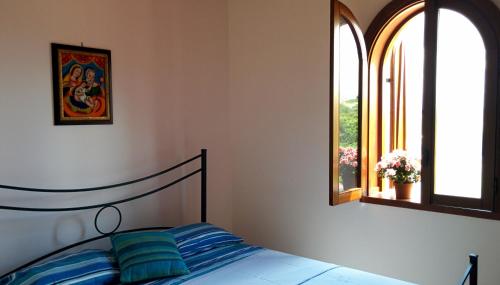 Säng eller sängar i ett rum på Il Gelsomino Home Holiday