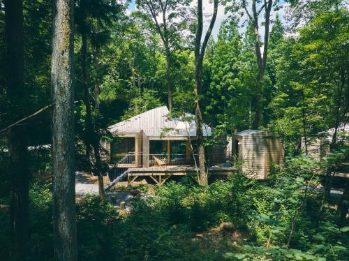 a house in the middle of the woods at SANU 2nd Home 白馬 1st in Hakuba
