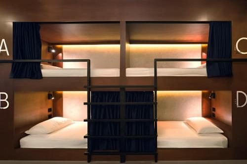 A bed or beds in a room at Yamato Hostel