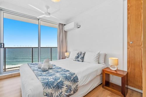 Ένα ή περισσότερα κρεβάτια σε δωμάτιο στο Stunning Beach & Ocean Views