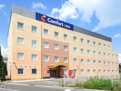 a building with a sign on the front of it at Comfort Inn Suwa Inter in Suwa
