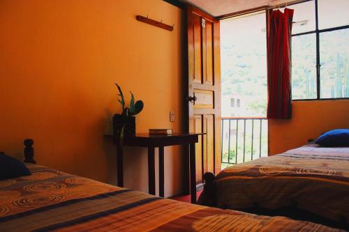 Postel nebo postele na pokoji v ubytování Hostal Timara