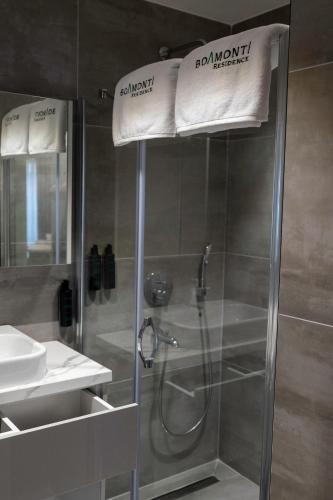 a bathroom with a shower with a towel on top of it at Boamonti Residence Sisli Apart in Istanbul