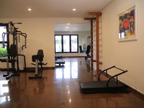 a gym with treadmills and exercise equipment in a room at The Park Hall Flat Service Higienópolis in Sao Paulo