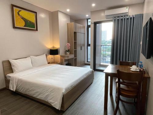 Giường trong phòng chung tại Fumi Residence Hanoi