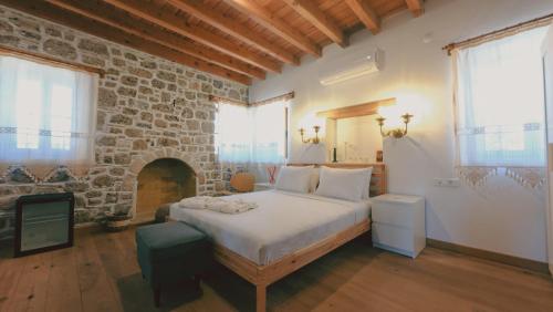 Ένα ή περισσότερα κρεβάτια σε δωμάτιο στο Madran House