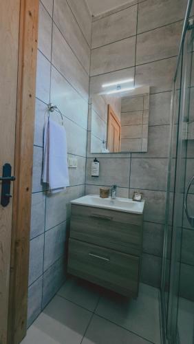 a bathroom with a sink and a mirror at Gulhiz in Datca