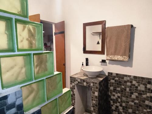 a bathroom with a sink and a mirror at Casa Azul in La Paz