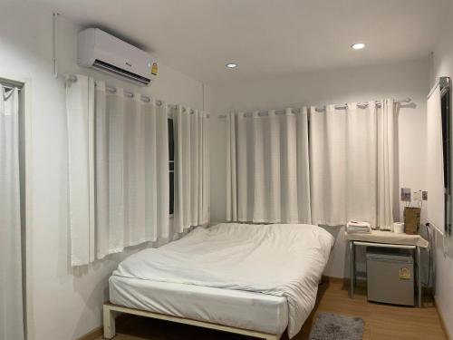 Postel nebo postele na pokoji v ubytování T-home Maerim