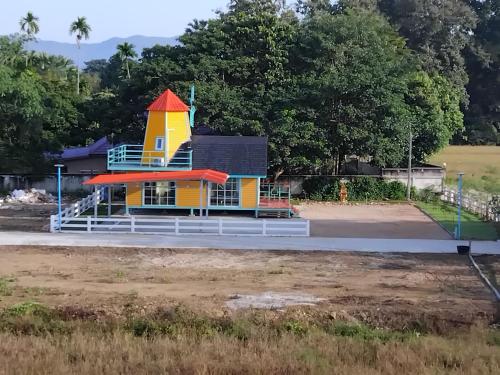a small structure on the side of a road at Villa molenstijl in Ban Muang Len