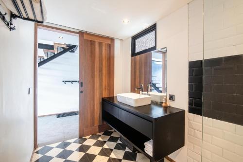 a bathroom with a sink and a mirror at New Duplex apartment 200m to Beach Canggu in Canggu