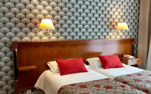 Ένα ή περισσότερα κρεβάτια σε δωμάτιο στο Logis Hotel Diana