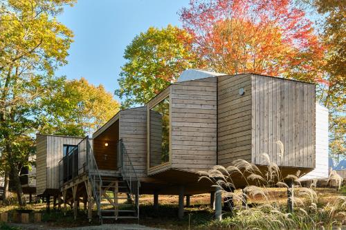 a tiny house on a stump in a field at SANU 2nd Home Tateshina1st in Chino