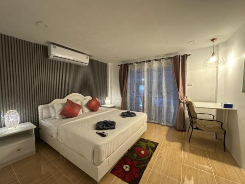 Ένα ή περισσότερα κρεβάτια σε δωμάτιο στο Inn Dulgence