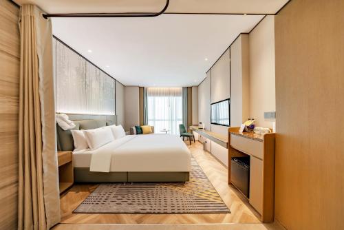 Postel nebo postele na pokoji v ubytování Holiday Inn Taiyuan City Center