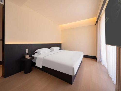 Ένα ή περισσότερα κρεβάτια σε δωμάτιο στο Yunyi Zizai Hotel Hohhot Agricultural University Branch