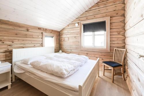 En eller flere senge i et værelse på Stranda Fjellgrend 3 bedrooms - 68B