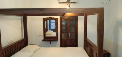 Ένα ή περισσότερα κρεβάτια σε δωμάτιο στο Villa Coconut Tree