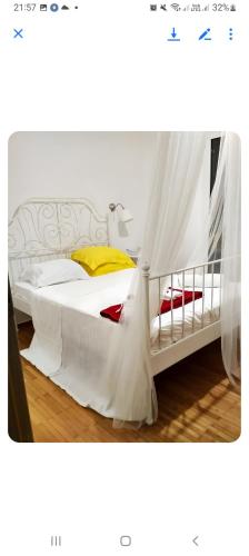 a bedroom with a white bed with a canopy at Dreaming of Greece A4 in Athens