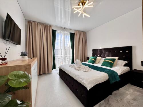 TV a/nebo společenská místnost v ubytování Ultracentral Piata Victoriei 50- City Center View