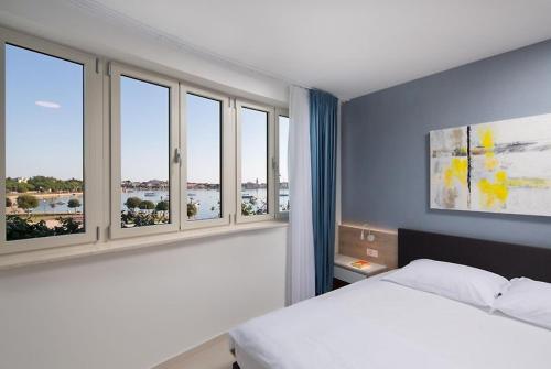 Ένα ή περισσότερα κρεβάτια σε δωμάτιο στο Garden Palace Resort