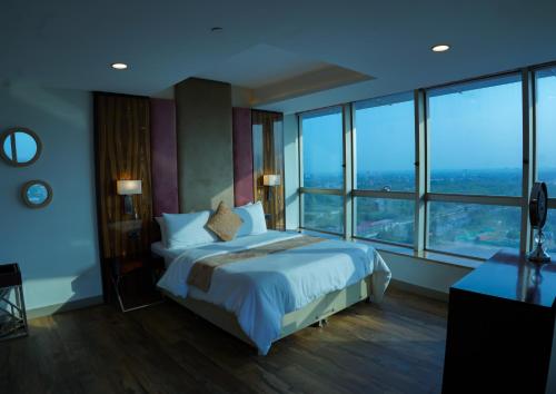 En eller flere senge i et værelse på Walk-Inn Hospitality Group Centaurus