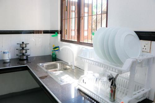 Kuchyň nebo kuchyňský kout v ubytování Trio Jay Villa