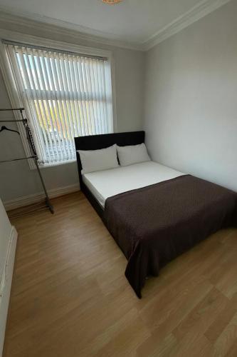 Ένα ή περισσότερα κρεβάτια σε δωμάτιο στο Simple & Peaceful Space