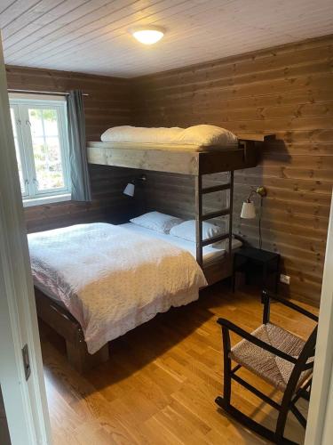 En eller flere senge i et værelse på Stranda Fjellgrend 3 bedrooms - 29C