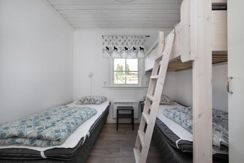 Ένα ή περισσότερα κρεβάτια σε δωμάτιο στο Älvdalens Camping