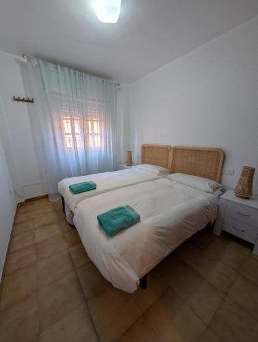 Ένα ή περισσότερα κρεβάτια σε δωμάτιο στο 195 Livingtarifa Jazmin