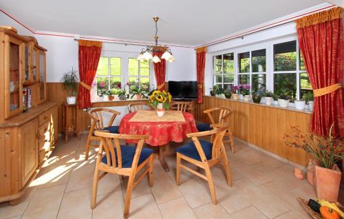 a dining room with a table and chairs at Lauras - Landhauspension in Medebach