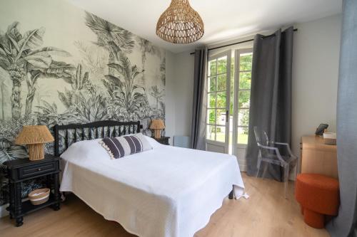 Кровать или кровати в номере Appartement pour 6 personnes- Villa LOU BOUSQUET étage