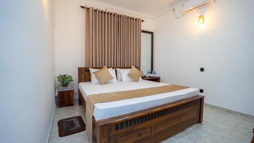 Ένα ή περισσότερα κρεβάτια σε δωμάτιο στο Green Serenity