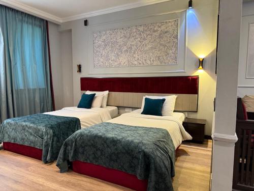 Postel nebo postele na pokoji v ubytování Hazz-Museum Art Hotel