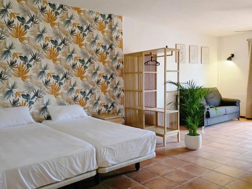 Postel nebo postele na pokoji v ubytování Hotel Ecolife Tenerife