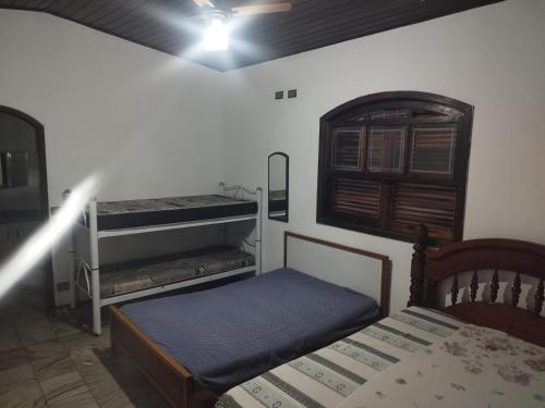 Giường trong phòng chung tại Chácara meu paraíso em Nazaré paulista