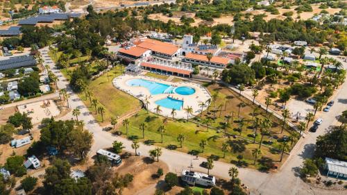 an aerial view of a resort with a pool at HolaCamp Albufeira in Albufeira