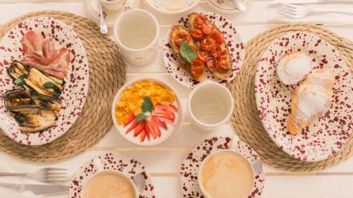 a table with many plates of food on it at Tenuta Doxi in Gallipoli