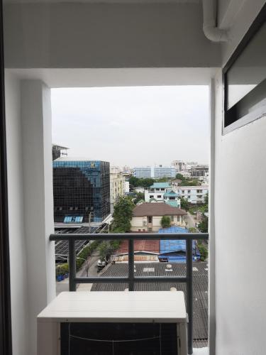 a view of a city from a balcony at Regent Ngamwongwan Hotel in Nonthaburi